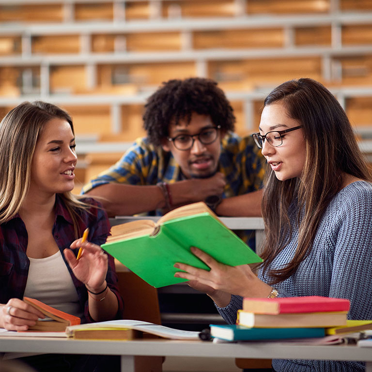 Three students studying in class together