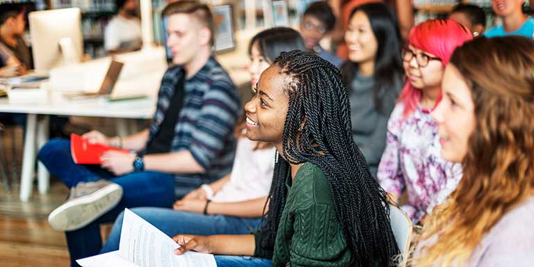 Diverse group of graduate students listening in class