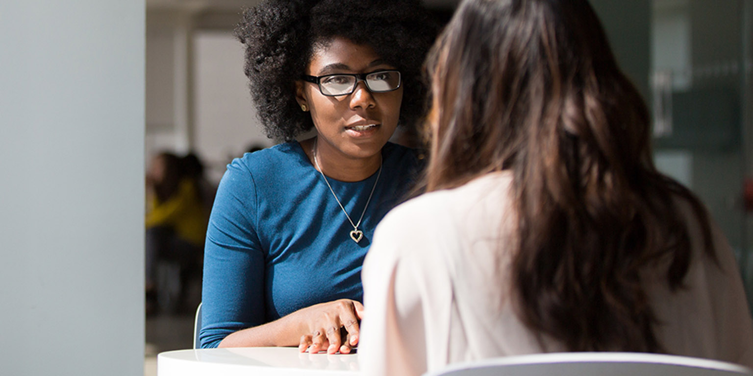 A counselor speaking with a student