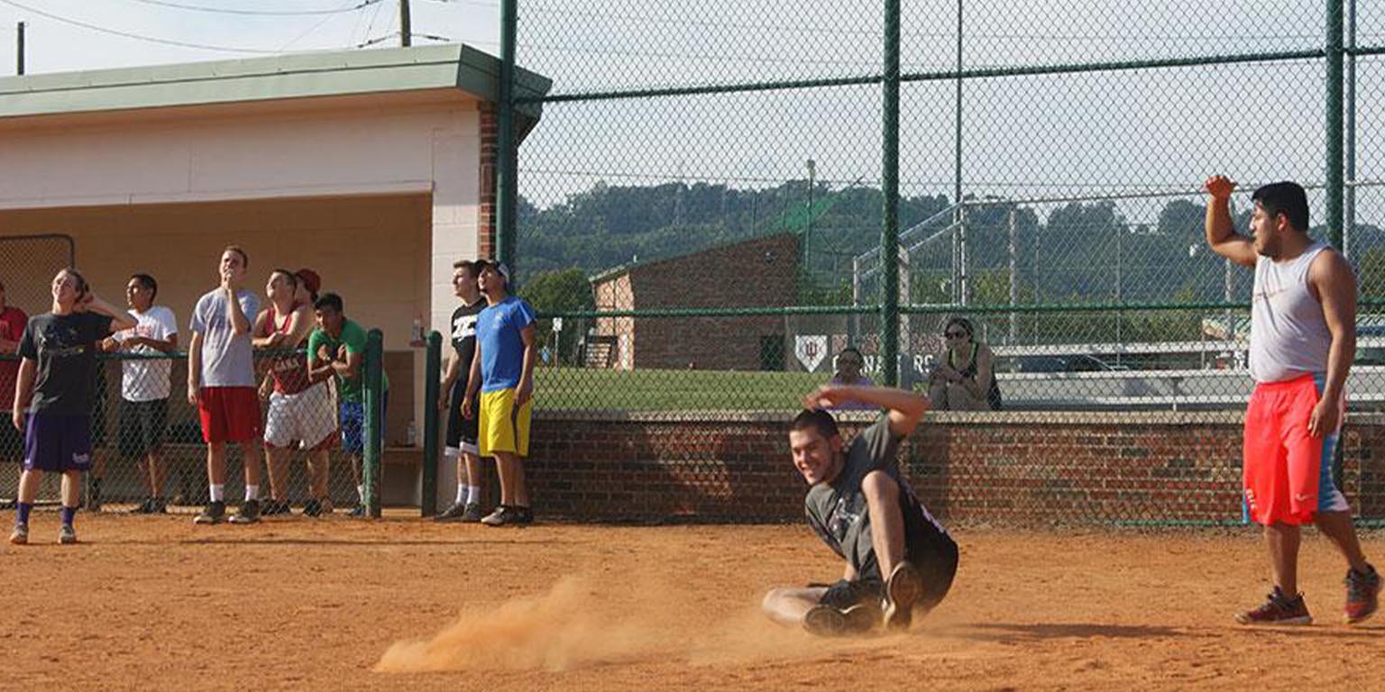 Students playing intramural kickball