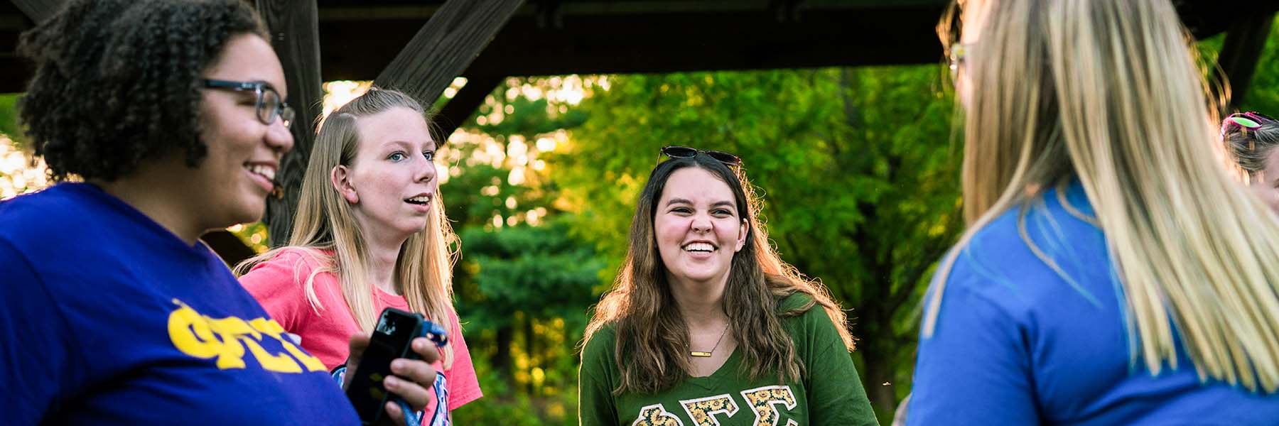 Sorority girls talking and laughing on campus